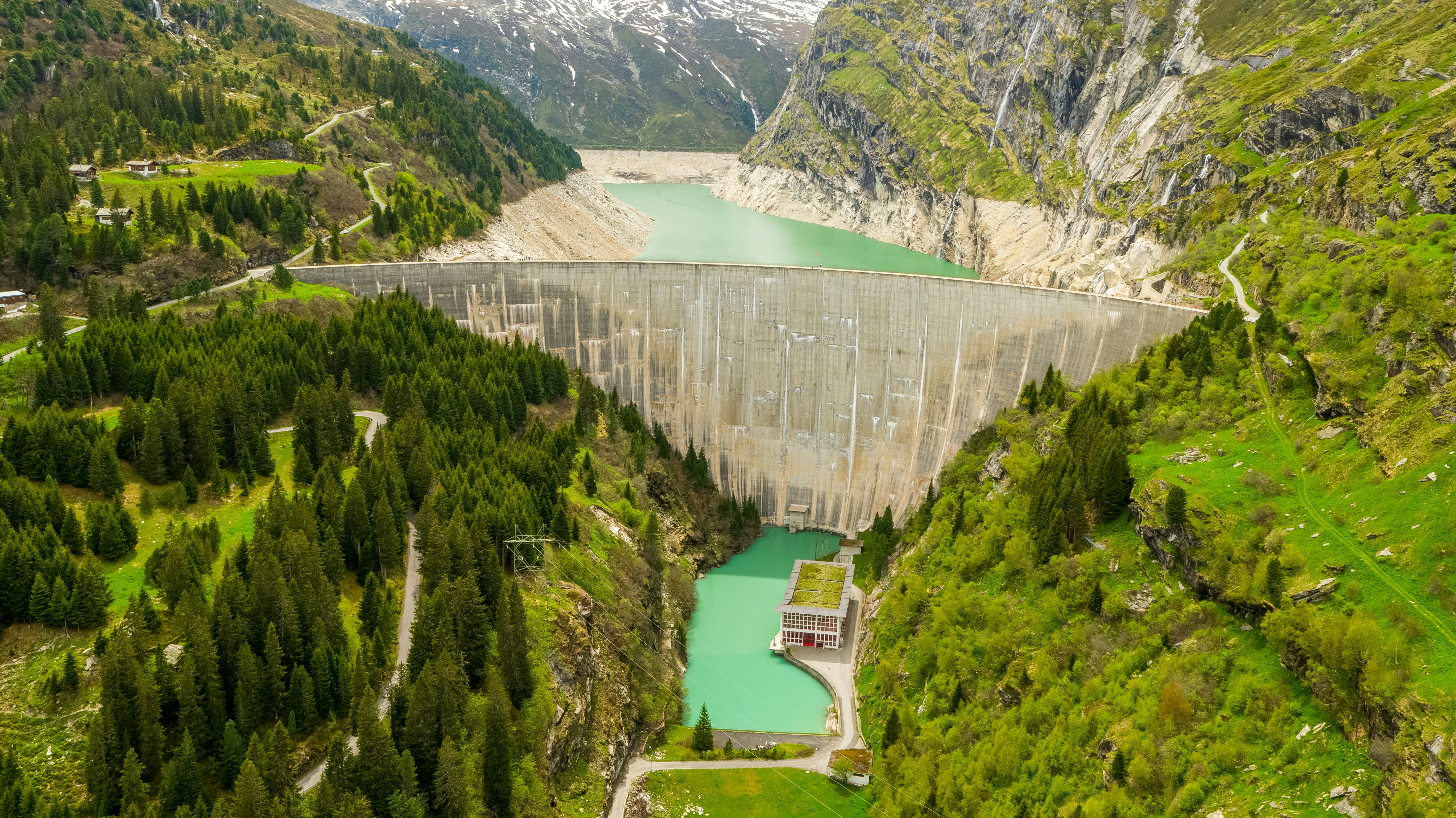 green river between green mountains during daytime